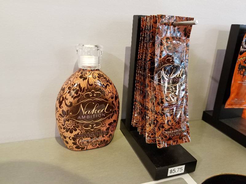 lot 296 image: Naked Ambition Natural Bronzer Designer Skin w Display