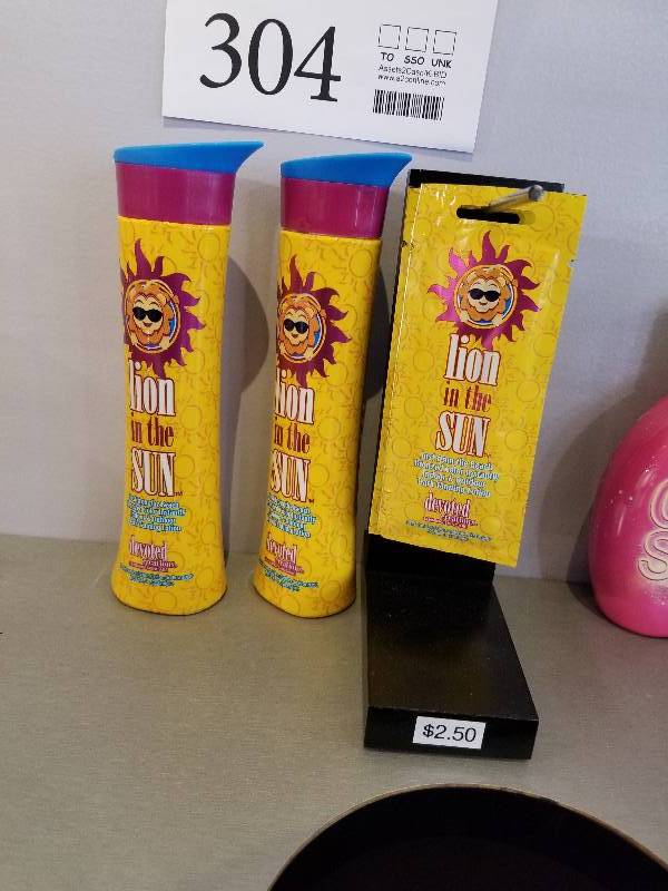 lot 304 image: Lot of (2) Devoted Creations Lion In The Sun Tanning Skincare w Display