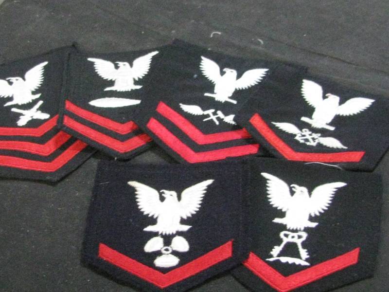 lot 54 image: US Navy Rating Badges