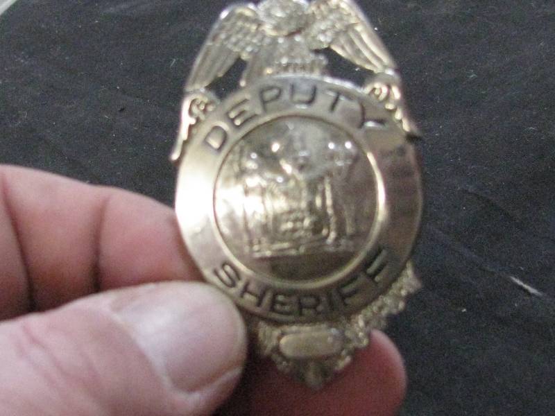 lot 72 image: Retired deputy Sheriff Badge