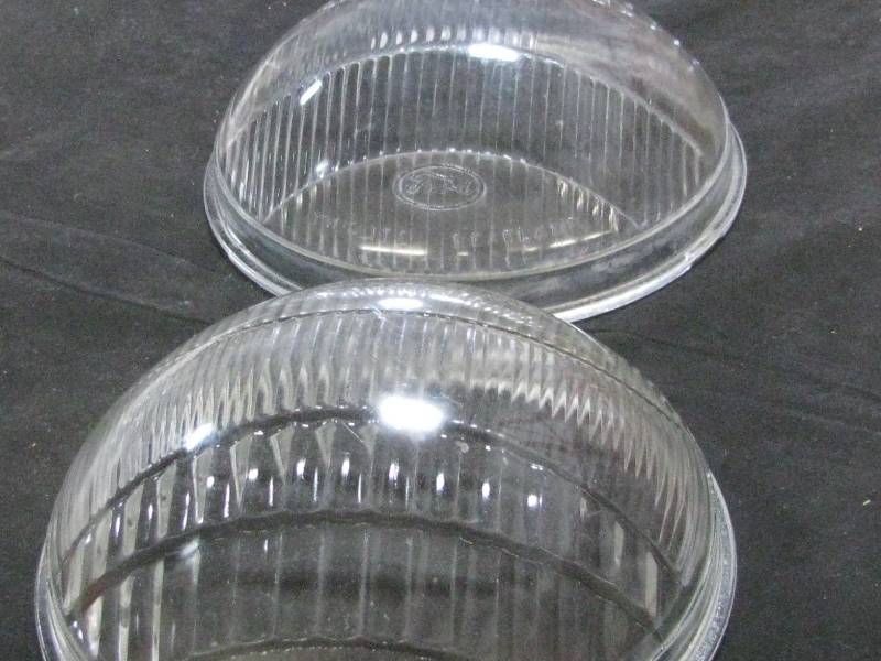 lot 77 image: Vintage Glass Ford Headlight Lenses