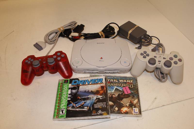 lot 24 image: VINTAGE ORIGINAL SLIM PLAY STATION WITH 2 CONTROLLERS AND 2 GAMES