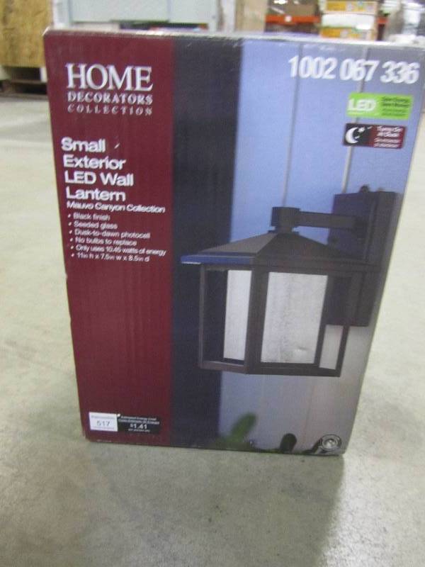 lot 61 image: Home Decorators Collection Black Outdoor Seeded Glass Dusk to Dawn Wall Lantern
