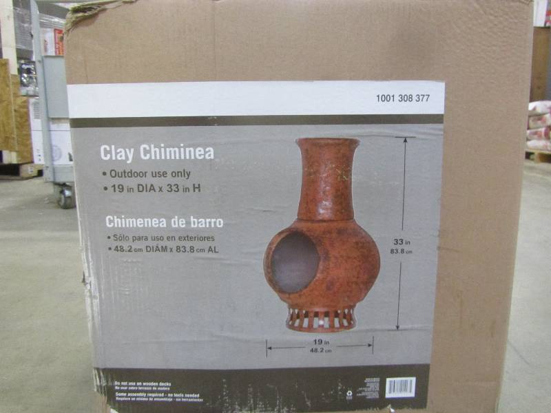 lot 63 image: 19 in. Clay Chiminea