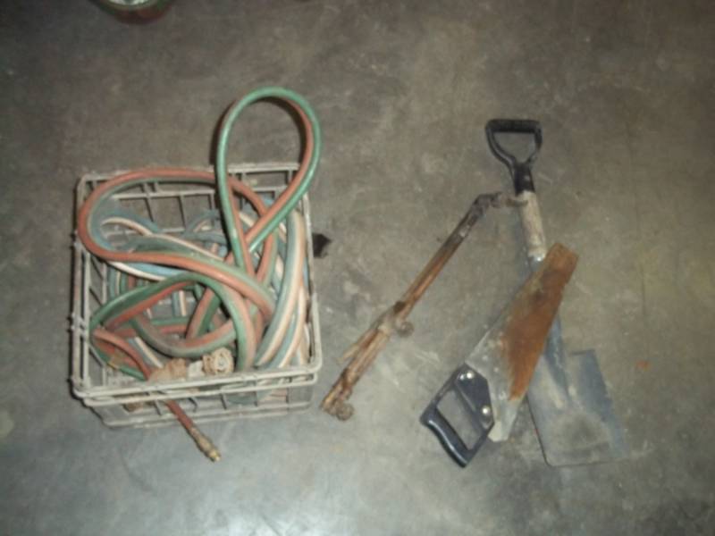 Torch with Shovel, saw and hose