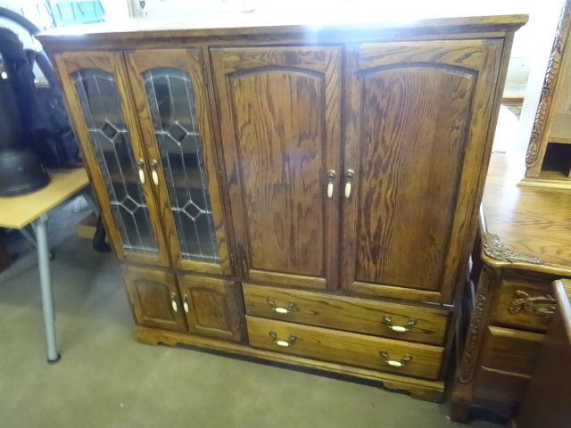 Wood entertainment center. 6 doors ...