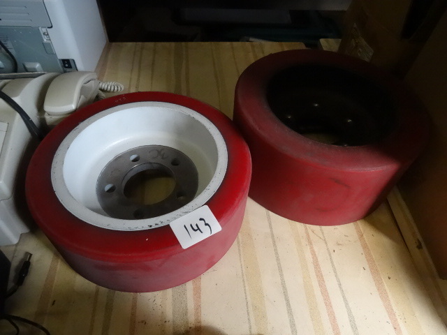 2 solid rubber tires. 5 hole rims. ...