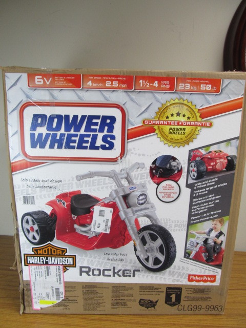 lot 23 image: Like New Power Wheels HARLEY DAVIDSON 3-Wheel Ride-On Vehicle