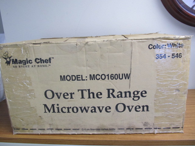 lot 44 image: BRAND NEW Over The Range Microwave Oven