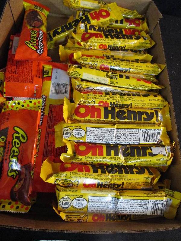 lot 41 image: Shelf Pulled Candy O Henry, Reeses Pieces in a cup, and Reeses Crunchy