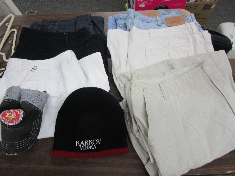lot 102 image: Sz 44 and 1 is a sz 42 7 prs Mens Shorts and Stocking hat and Baseball Cap