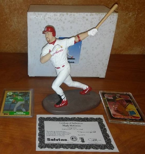 lot 8 image: Mark McGwire Rookie Cards and Salvino Statue.