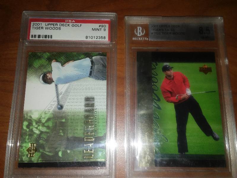 lot 19 image: Tiger Woods graded and encased cards.