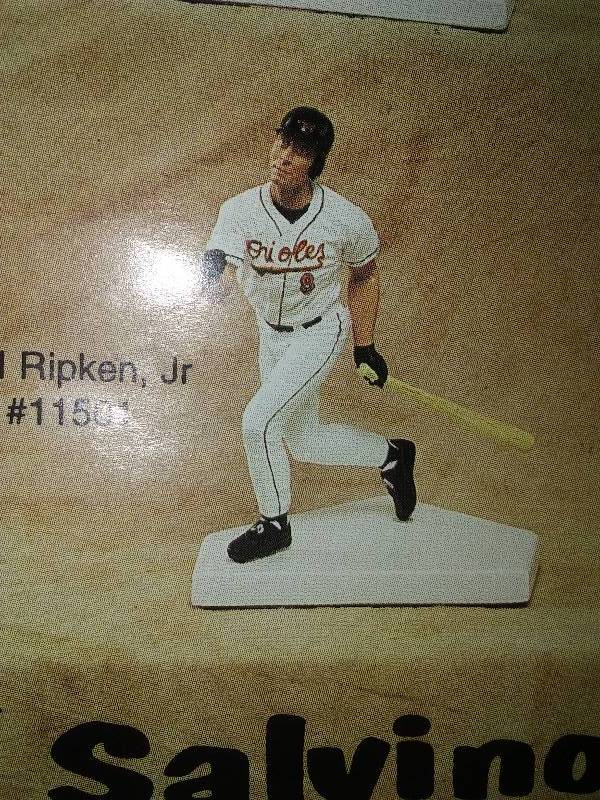lot 39 image: 2 Cal Ripken Jr. Statues plus 26 cards.