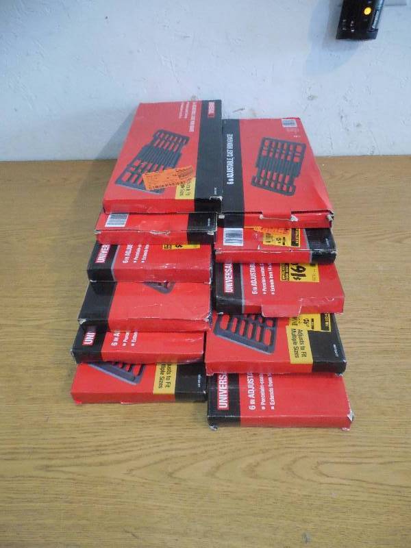 lot 47 image: (11) 20 in. x 6 in. Adjustable Cast Iron Cooking Grate