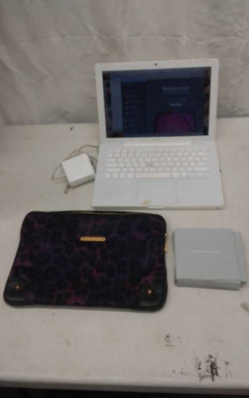 lot 9 image: MAC Apple Book Lap Top (Works) With Charger & Fitted Juicy Couture Case
