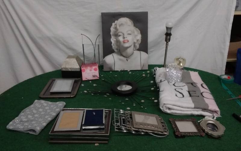 lot 26 image: Large Lot Of Marilyn Monroe Picture, Victorias Secret Blanket. Stash Box, Lamp, Misc Wall Decor, Gems