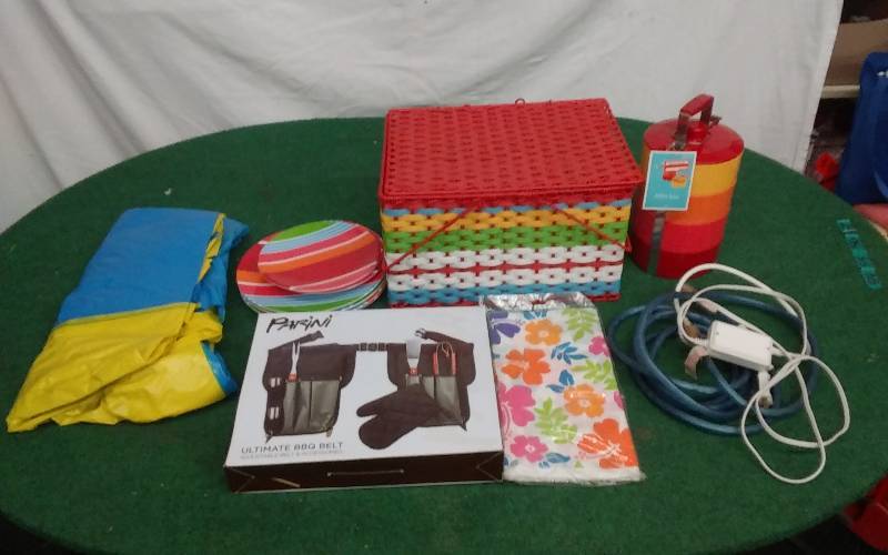 lot 54 image: Picnic Basket, Picnic Dishes, Rope Lights, BBQ Apron Set, Inflatable
