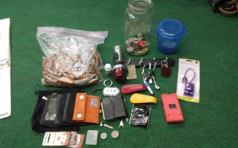 lot 93 image: Large Lot Of AA Batteries, Wallets, Keys, Key Chains, Tazer, Misc