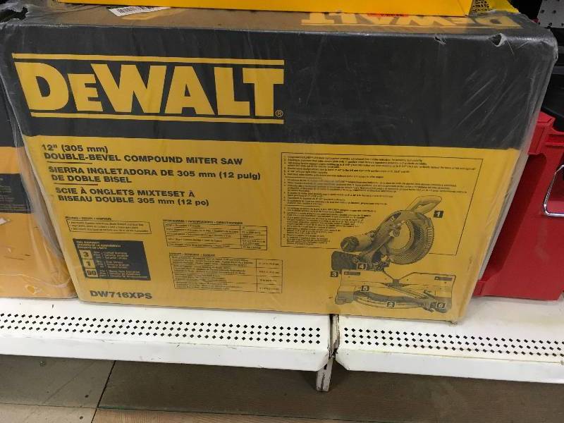 lot 131 image: DEWALT 15 Amp 12 in. Double-Bevel Compound Miter Saw with XPS Light New