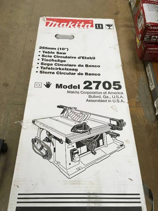 lot 133 image: Makita 15 Amp 10 in. Corded Contractor Table Saw with 25 in. Rip Capacity and 32T carbide blade new