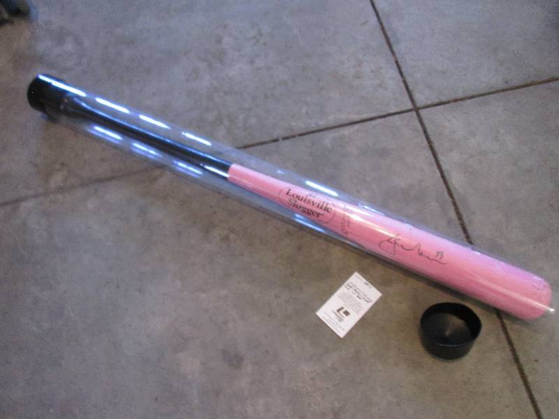 lot 68 image: Pink Justin Morneau autographed bat...