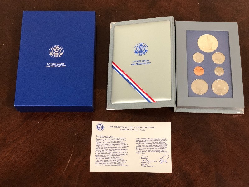 lot 17 image: U.S. 1986 Prestige 7-Piece Coin Col...