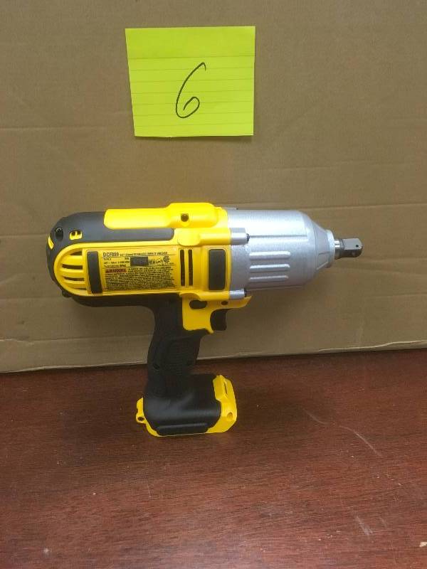 lot 6 image: DeWalt 20 Volt MAX Cordless Lithium-Ion 12 in. High-Torque Impact Wrench in like new working conditions