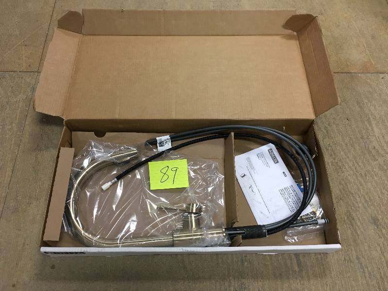 lot 89 image: Delta Trinsic Single Handle Pull-Down Kitchen Faucet Champagne Bronze Not used