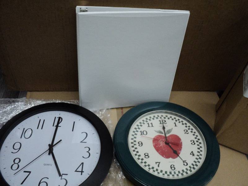 6 white binders and 2 clocks...
