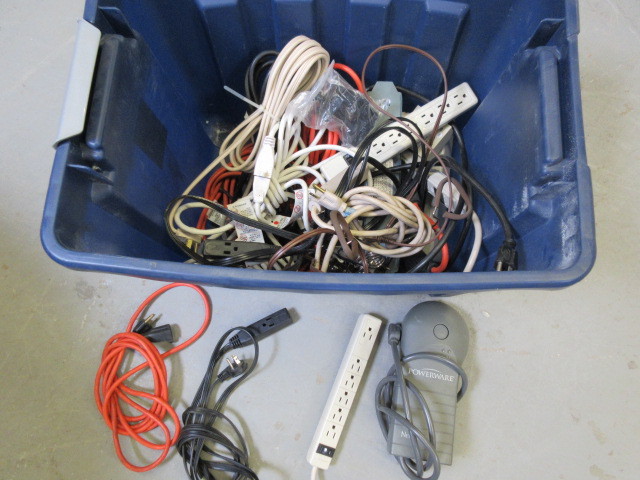 BIN OF EXTENSION CORDS AND POWER STRIPS