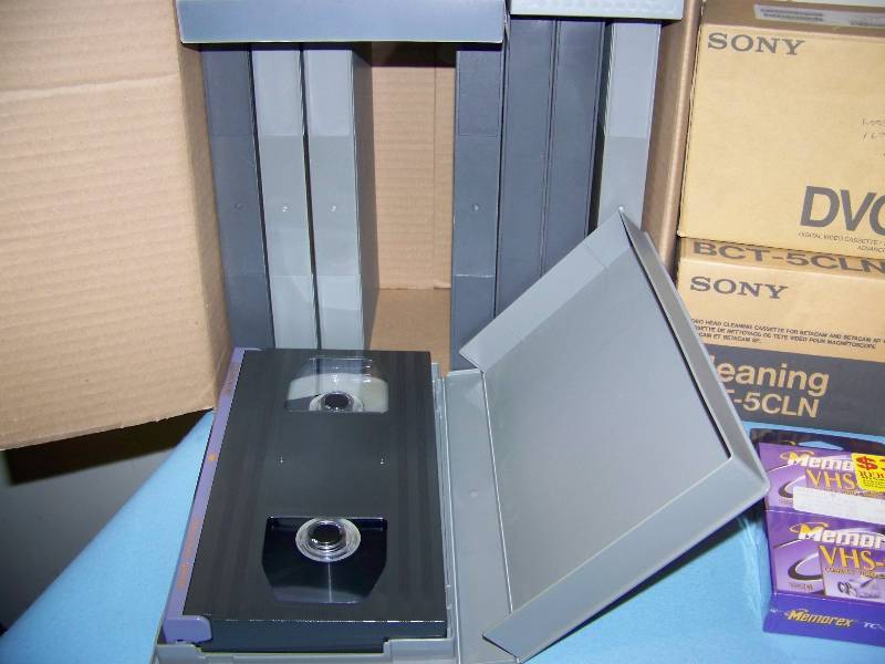 lot 81 image: Various DVCam Tapes, VHS Tapes and Audio Compact Discs - some NEW in Original Packaging