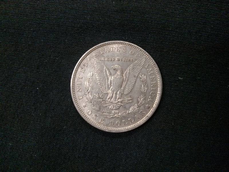 lot 6 image: 1880 Morgan Silver Dollar...