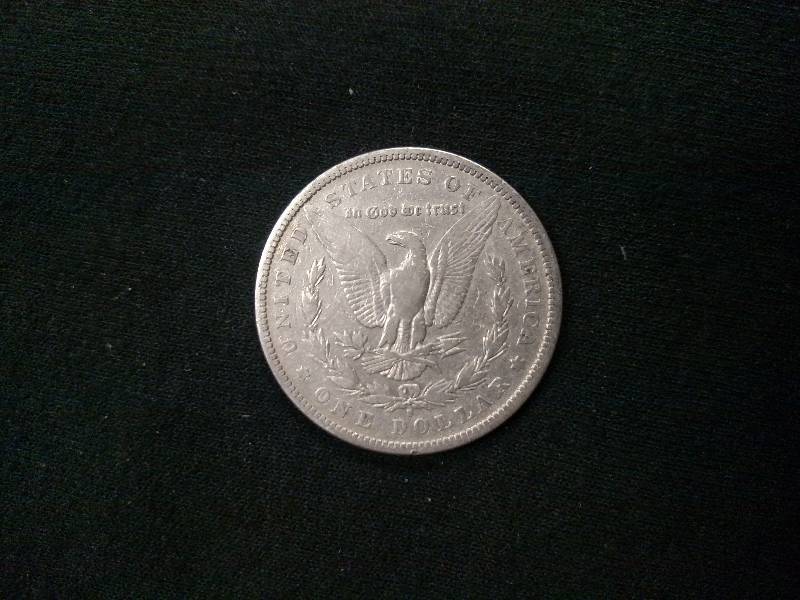 lot 10 image: 1881 S Morgan Silver Dollar...