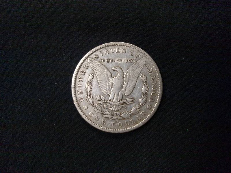 lot 17 image: 1884 O Morgan Silver Dollar...