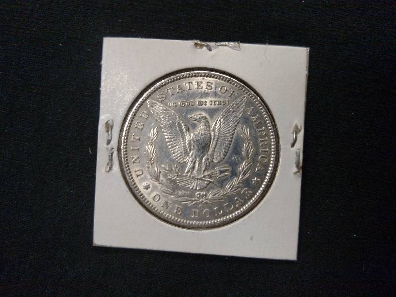 lot 19 image: 1885 O Morgan Silver Dollar...