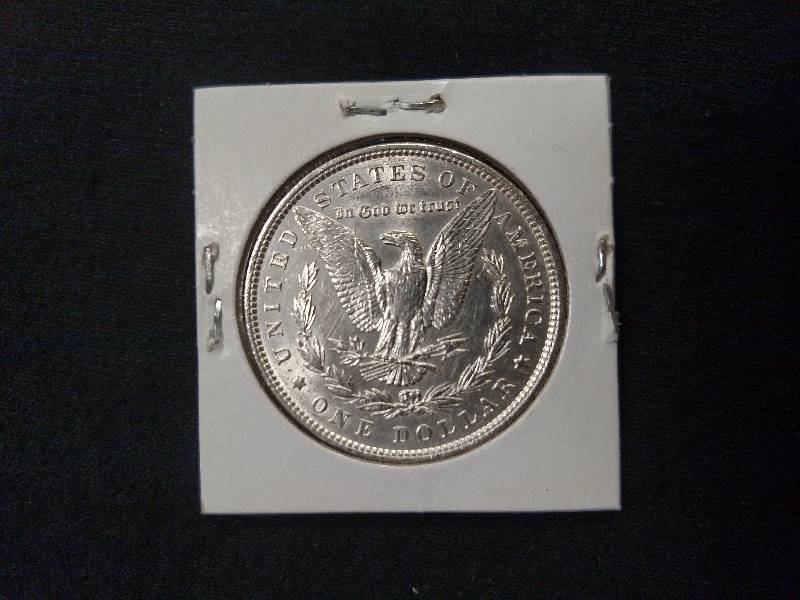 lot 21 image: 1886 Morgan Silver Dollar...