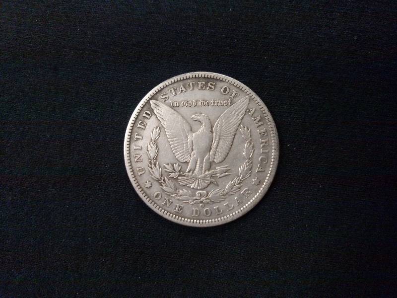 lot 23 image: 1886 O Morgan Silver Dollar...