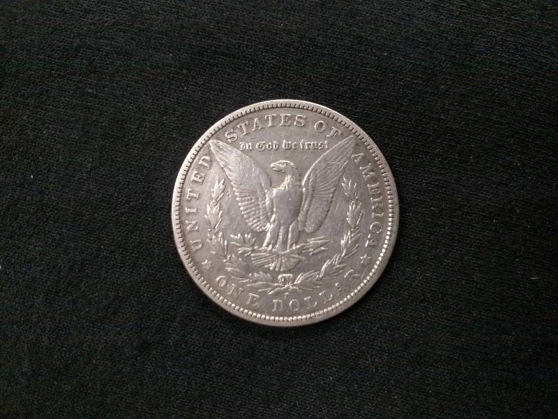 lot 53 image: 1899 S Morgan Silver Dollar...