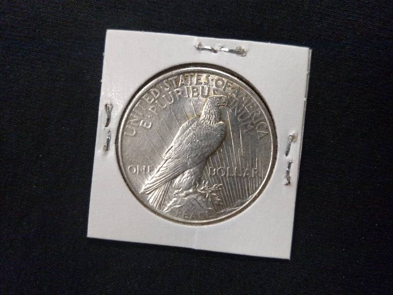 lot 101 image: 1925 Peace Silver Dollar...