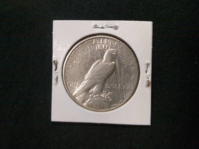lot 102 image: 1925 S Peace Silver Dollar...