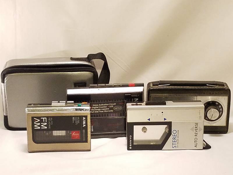 lot 174 image: VINTAGE WALKMAN CASSETTE PLAYERS, CASSETTES, VINTAGE RADIO, AND VOICE RECORDER