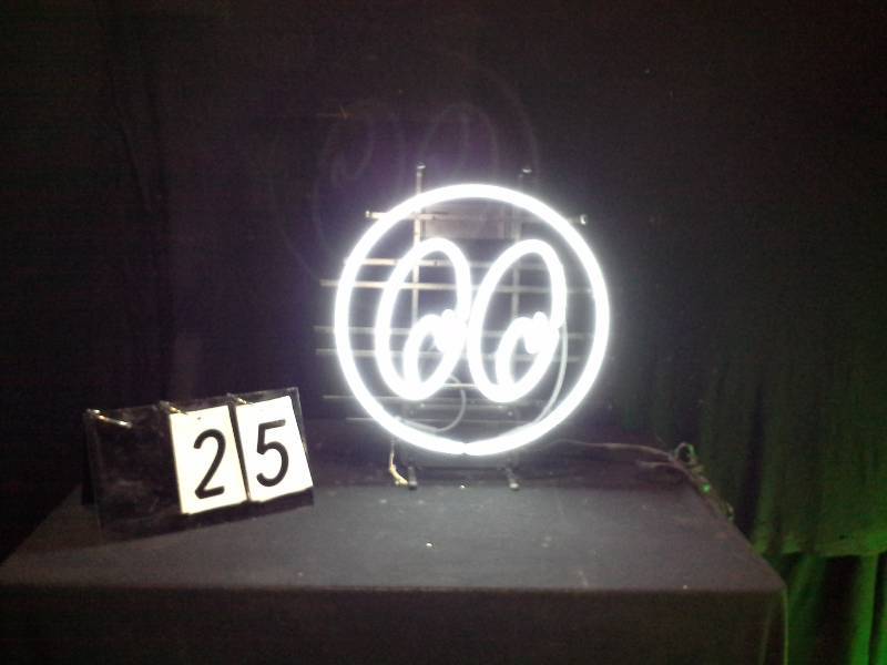 lot 25 image: Moon Eyes hubcap logo neon