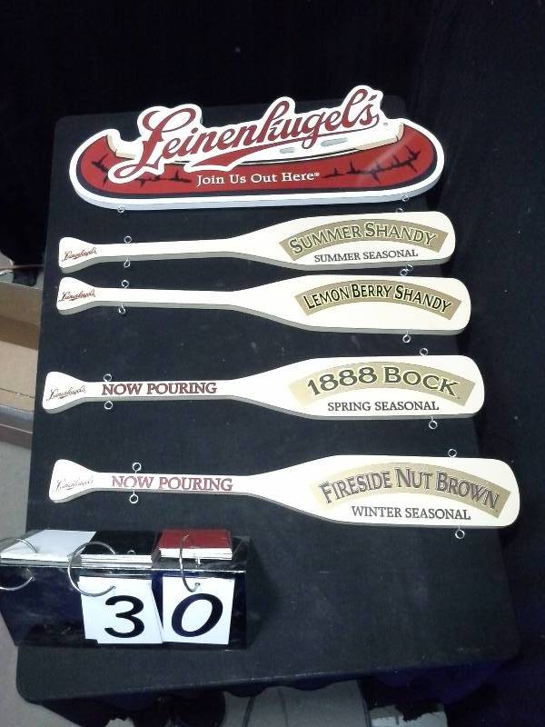 lot 30 image: Leinies Leinenkugels Now Pouring, Winter, Spring and Summer Seasonal paddle signs