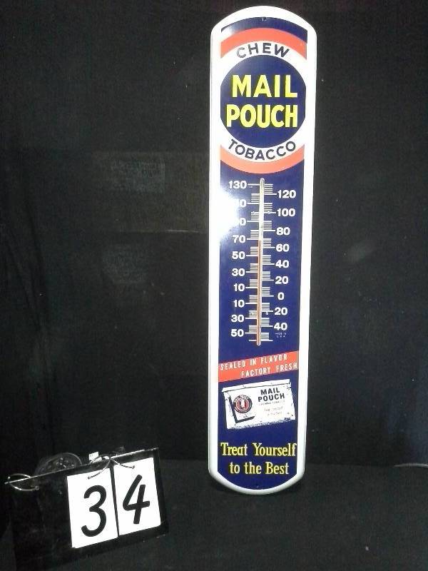 lot 34 image: Mail Pouch painted tin thermometer