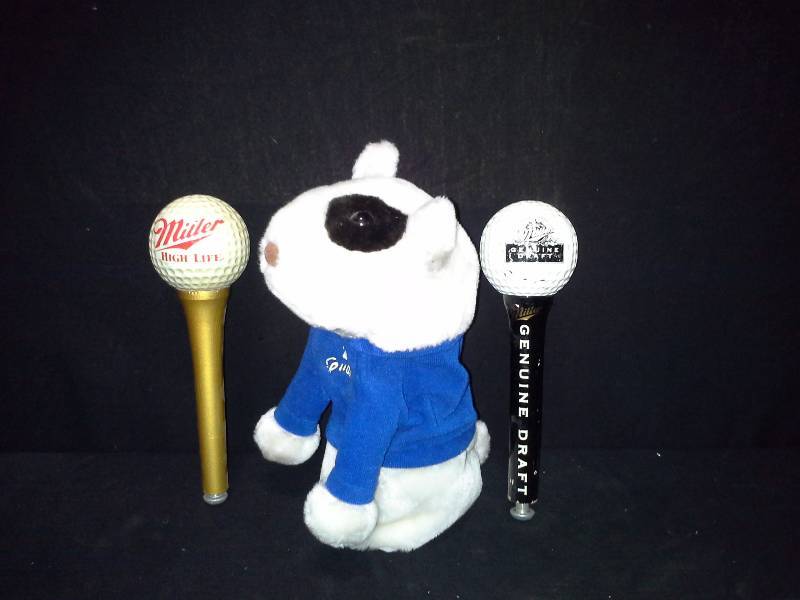 lot 180 image: Spuds Mackenzie golf club head cover, Miller High Life and Miller Genuine Draft Beer golf ball tap handles
