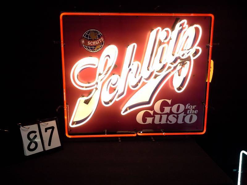 lot 87 image: Schlitz Go for the Gusto tin tacker sign with neon