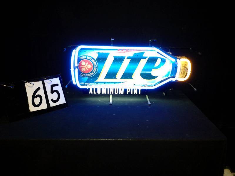 lot 65 image: Miller Lite aluminum pint bottle neon sign