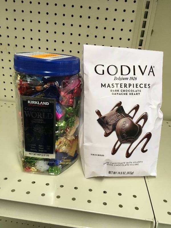 lot 50 image: KS CHOC OF THE WRLD 32 OZ, RETAIL $9.99 AND GODIVA DK CHOC HEARTS, RETAIL $8.59