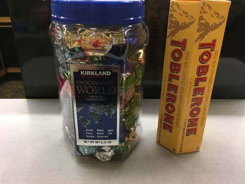 lot 103 image: KS CHOC OF THE WRLD 32 OZ, RETAIL $9.99 AND TOBLERONE MCHOC 63.52Z, RETAIL $7.79